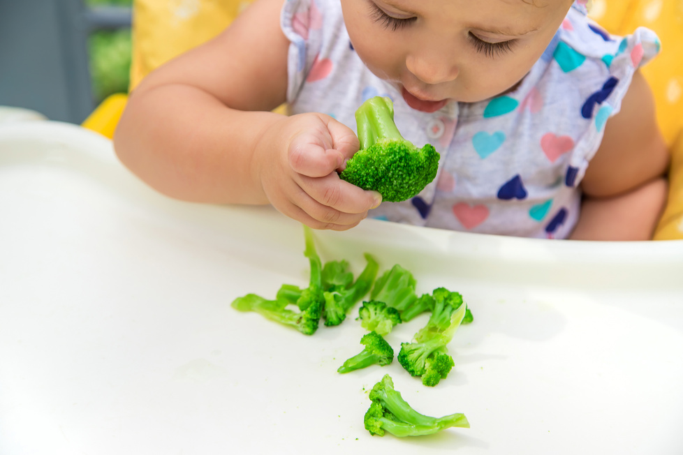 Cute Baby Eating Broccoli